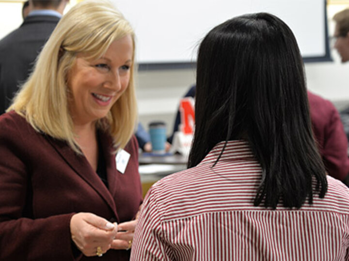 Student networking with Employer