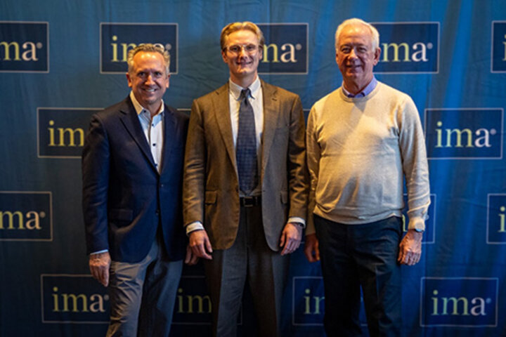 Kevin Crown with IMA reps at conference
