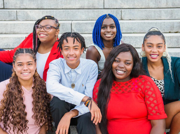Paska Juma (first row, right) and the other six co-founders of the Black Leaders Movement won the Young Citizens of the Year award from the Lincoln Young Professionals Group.