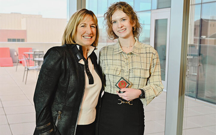 Briana Sulentic smiles with Dean Kathy Farrell