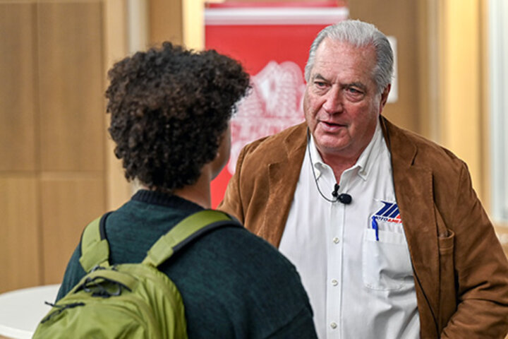 Richard Varner talks with a student