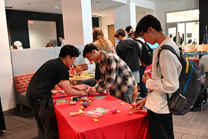 Students learn games and origami at the Japanese cultural celebration hosted by the Office of Global Experiences and the university's Kawasaki Reading Room.
