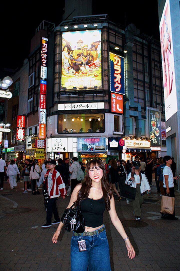 Emily smiles on a busy corner in South Korea