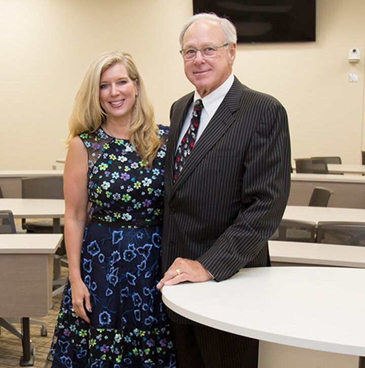 Lisa and Tom Smith pose in the classroom they sponsored