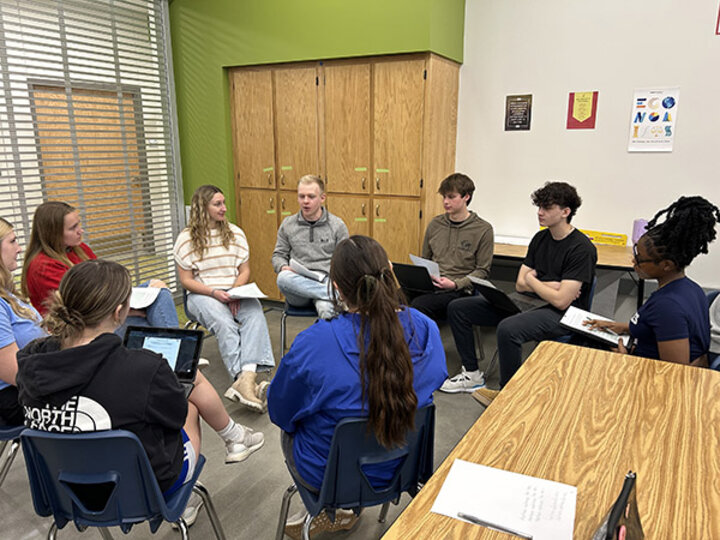 Nebraska's strengths coaches prepared to lead workshops in Malaysia by practicing their workshop with students at Standing Bear High School.