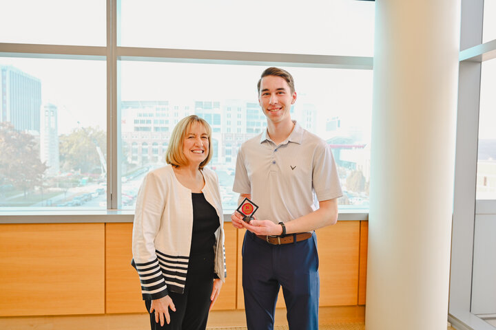 Adam poses with Dean Kathy Farrell