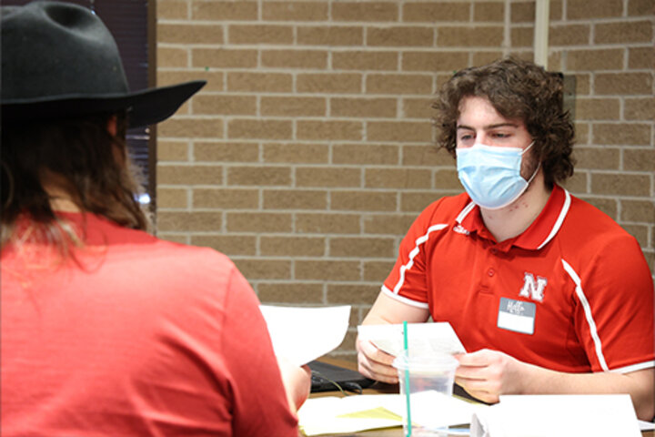 Carson Swartzbaugh, an accounting and finance major from Omaha, prepares taxes in the VITA program.