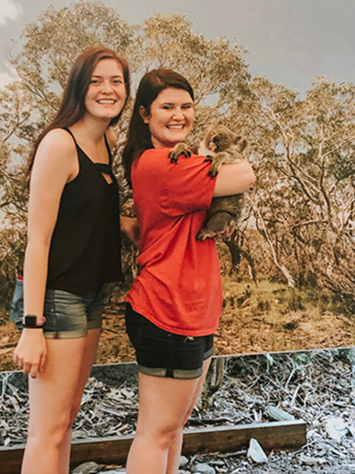 Anna and Hallie pose with a Koala at Hartley’s Crocodile Adventures.