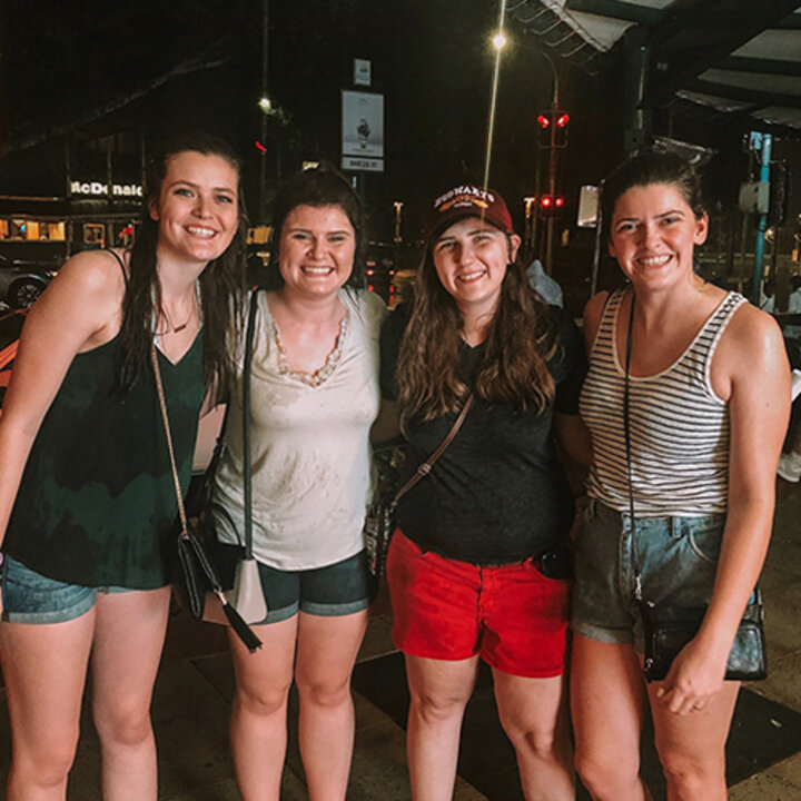 Hallie Lockhart and three other Huskers after running though the rain.