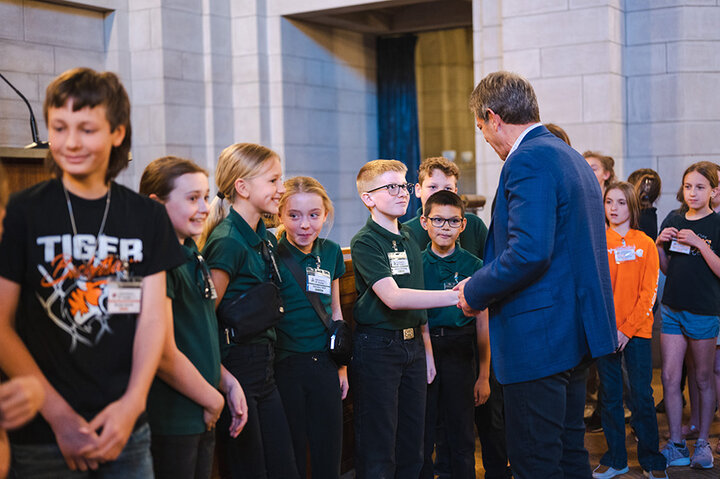 Students with Governor Jim Pillen, ‘79