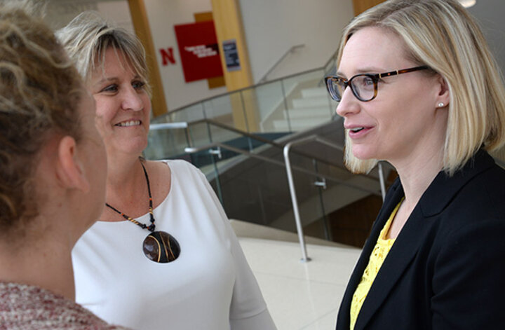 Larson consults with Celeste Spier and Chris Timm to improve student career programs at the College of Business.