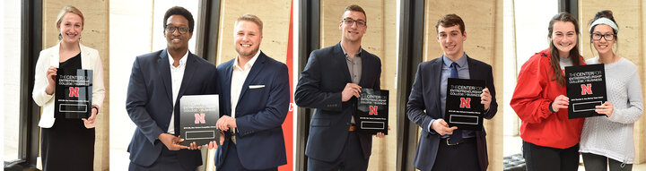 New Venture competition winners show awards at final ceremony.