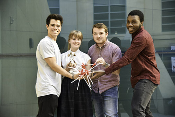 Holding their trophy and device is team Project Nitrogen (left to right): Joey Osbron, Elise Raymond, Caleb Sneed and Quincey Bernard.
