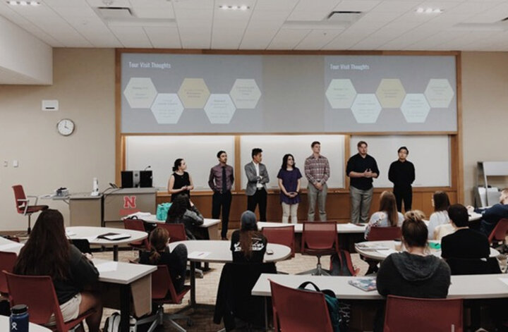Site visit group presenting what they learned on their visit.