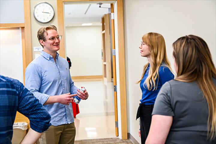 Kevin Crown meets M.S. supply chain grads at open house