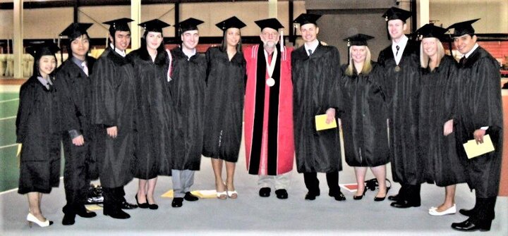 Warren Luckner with graduating class